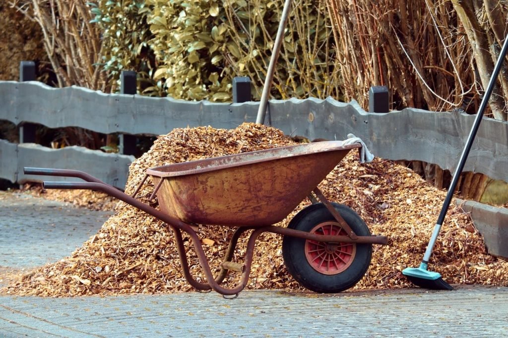 a wheelbarrow and other garden tools help make your work easier