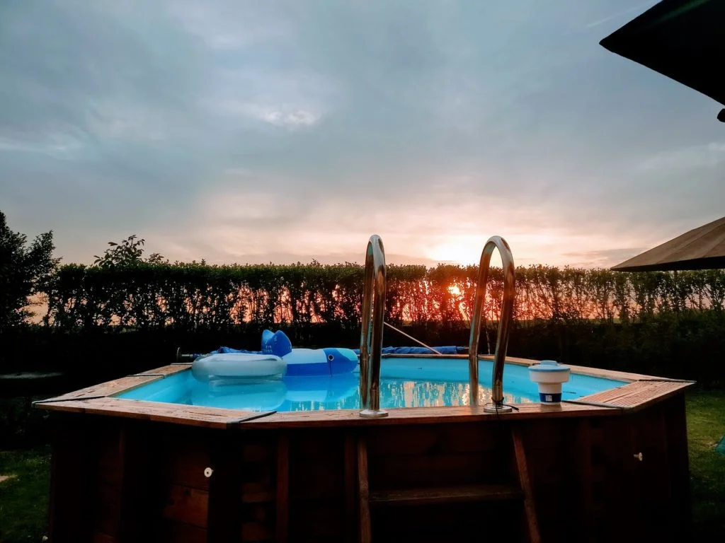 above ground swimming pool at sunset
