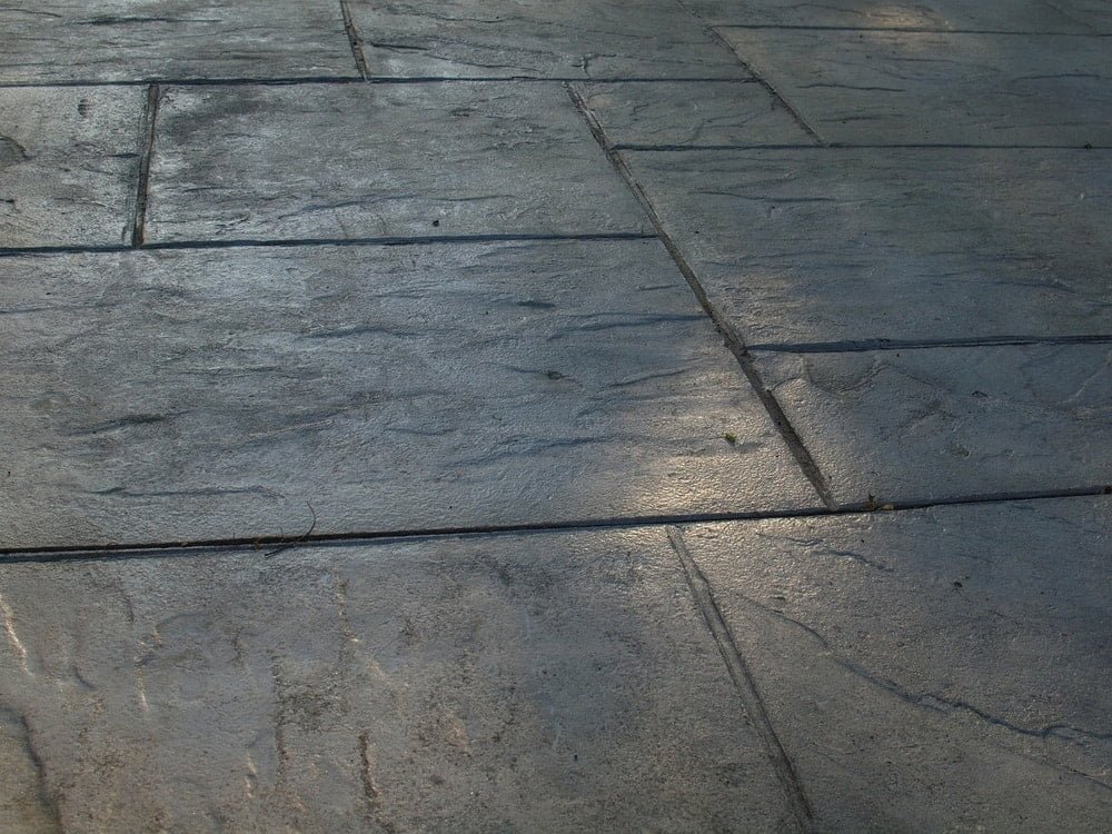 stamped concrete can look like natural stone or many other materials. It's an economical patio material
