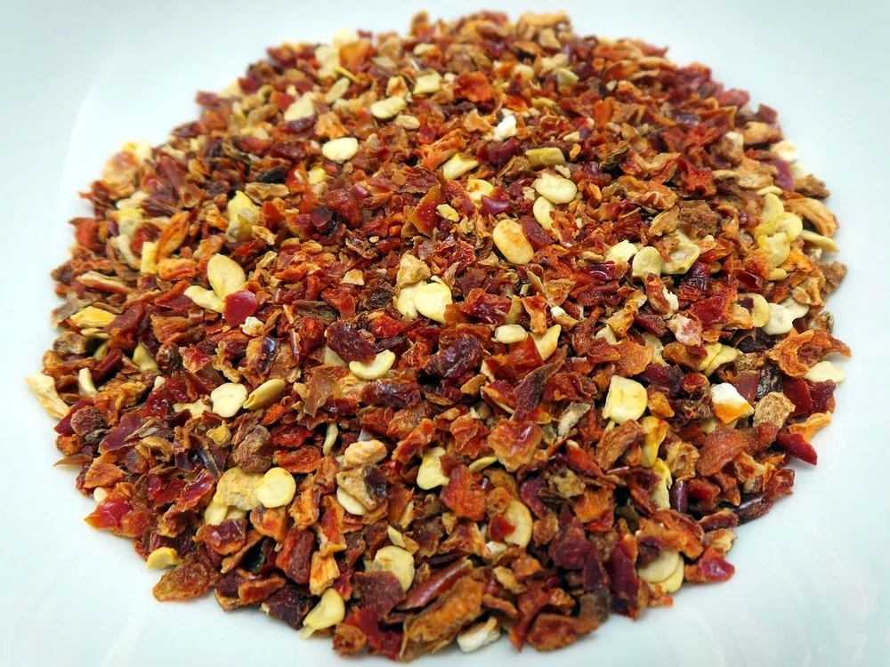 mixing hot pepper flakes with water and spraying it around you garden can keep deer away