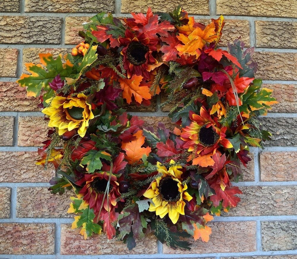 autumn wreath with leaves and sunflowers