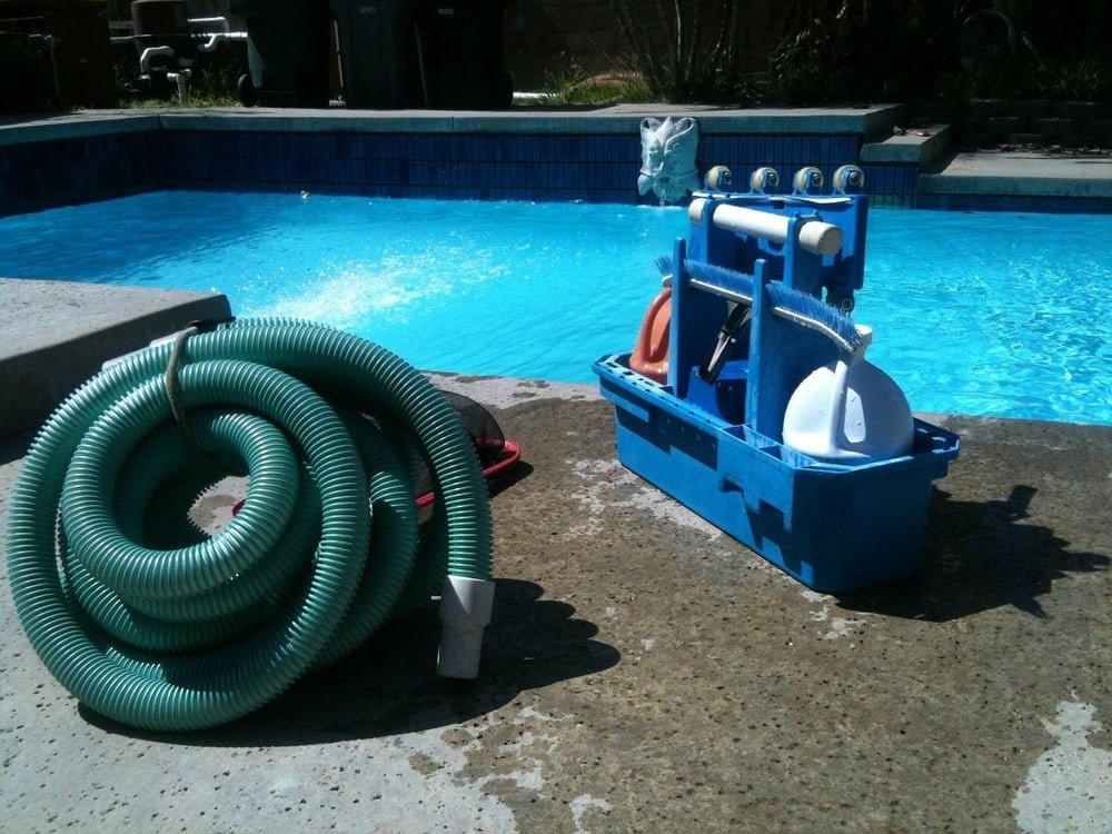 a pool vacuum helps get debris off the bottom of the pool