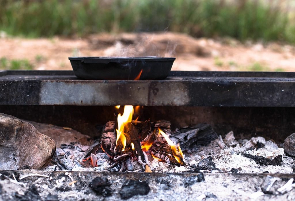 cooking on a public charcoal grill