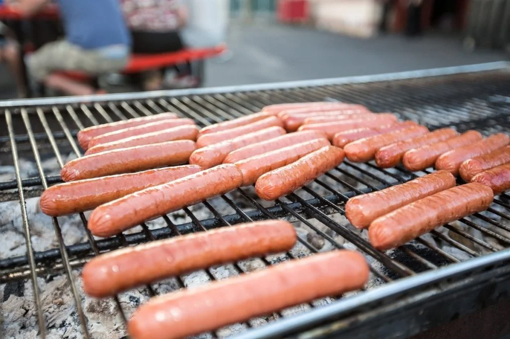 place your hot dogs perpendicular to the bars on your grill to get a better look and more even heating