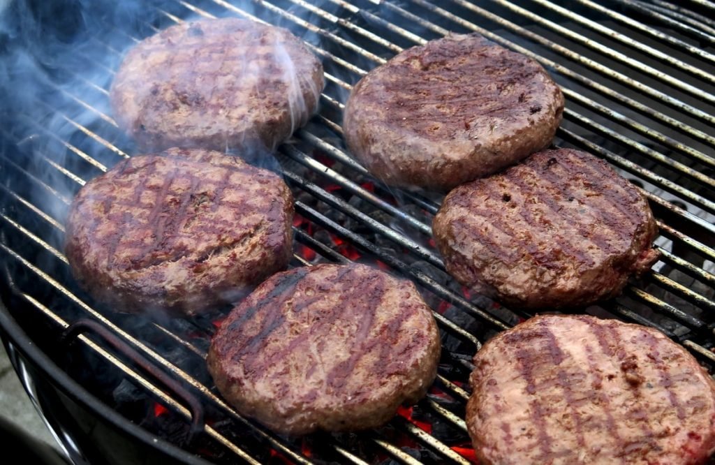 sear your hamburgers on the grill for a few minutes on each side
