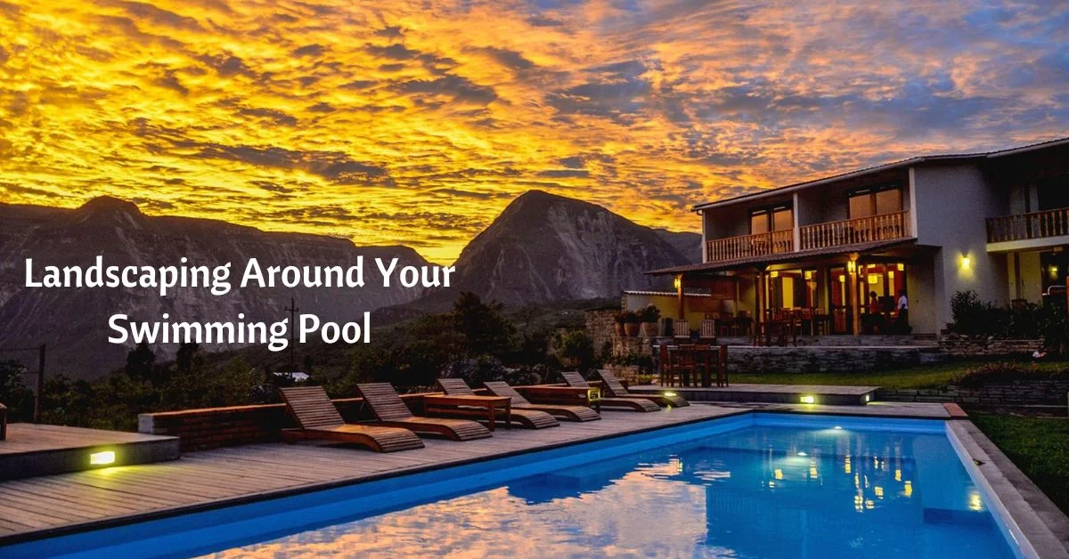 swimming pool behind house with majestic mountains behind. cloud roll in at sunset. text reads landscaping around your swimming pool