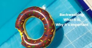 Text on a background image of a swmming pool with a ring float. Text reads, Backwashing: what it is, why it's important