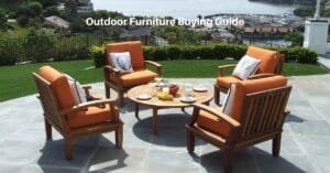 4 wooden teak chairs with orange cushions sit around a low teak table on a patio. Text reads, outdoor furniture buying guide